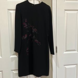 Elegant black dress, fully lined, long sleeves with designs
